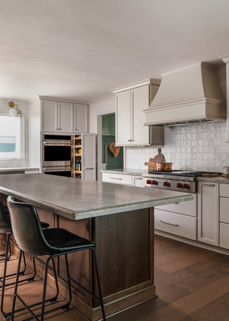 Plaster vent hood with floating shelves and custom built-ins — Matt Baker Contracting