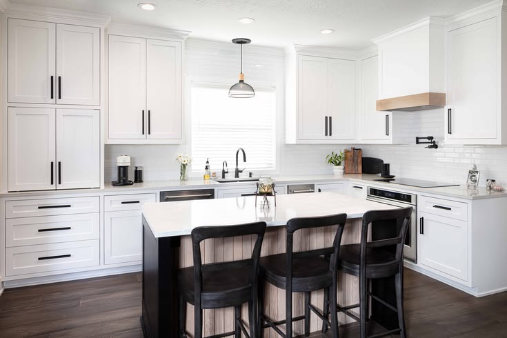 Kitchen with white cabinets, quartz counters and white oak accents — Matt Baker Contracting